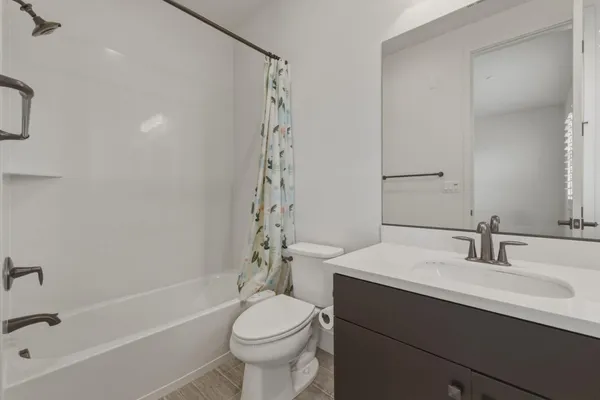 a bathroom with a sink a toilet and a bathtub