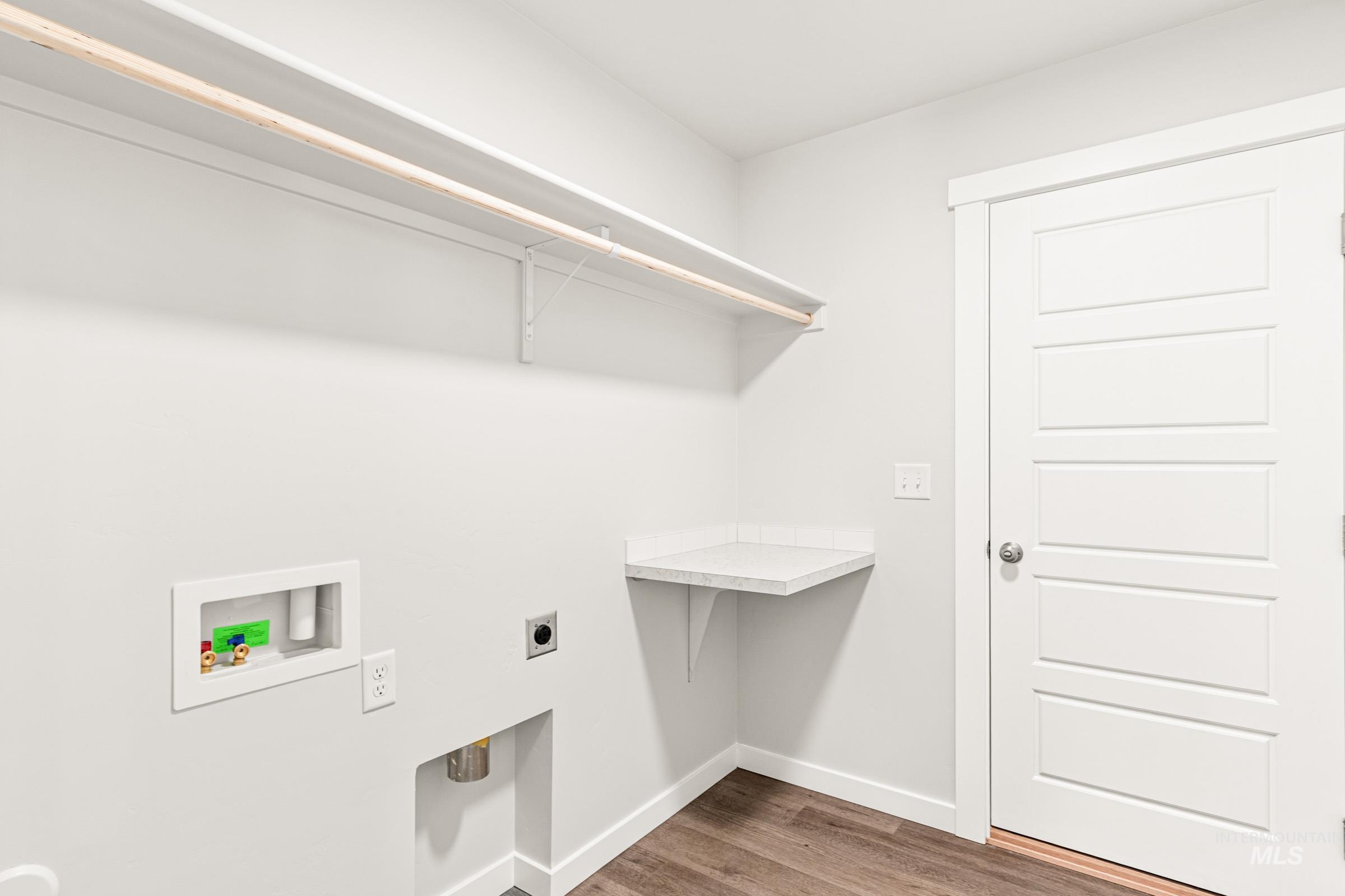 1077 West Jasper Street Meridian, ID 83642 - Photo 14 of 19 Dedicated utility room featuring wood-finish flooring and light-toned walls