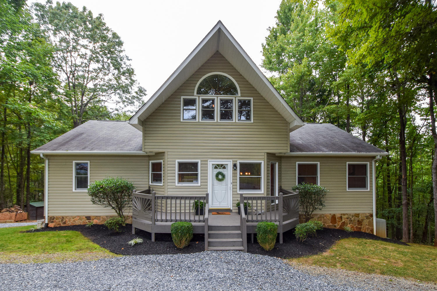 256 Deep Woods Road Hardy, VA 24101 - Photo 2 of 42 a front view of a house with a yard and porch