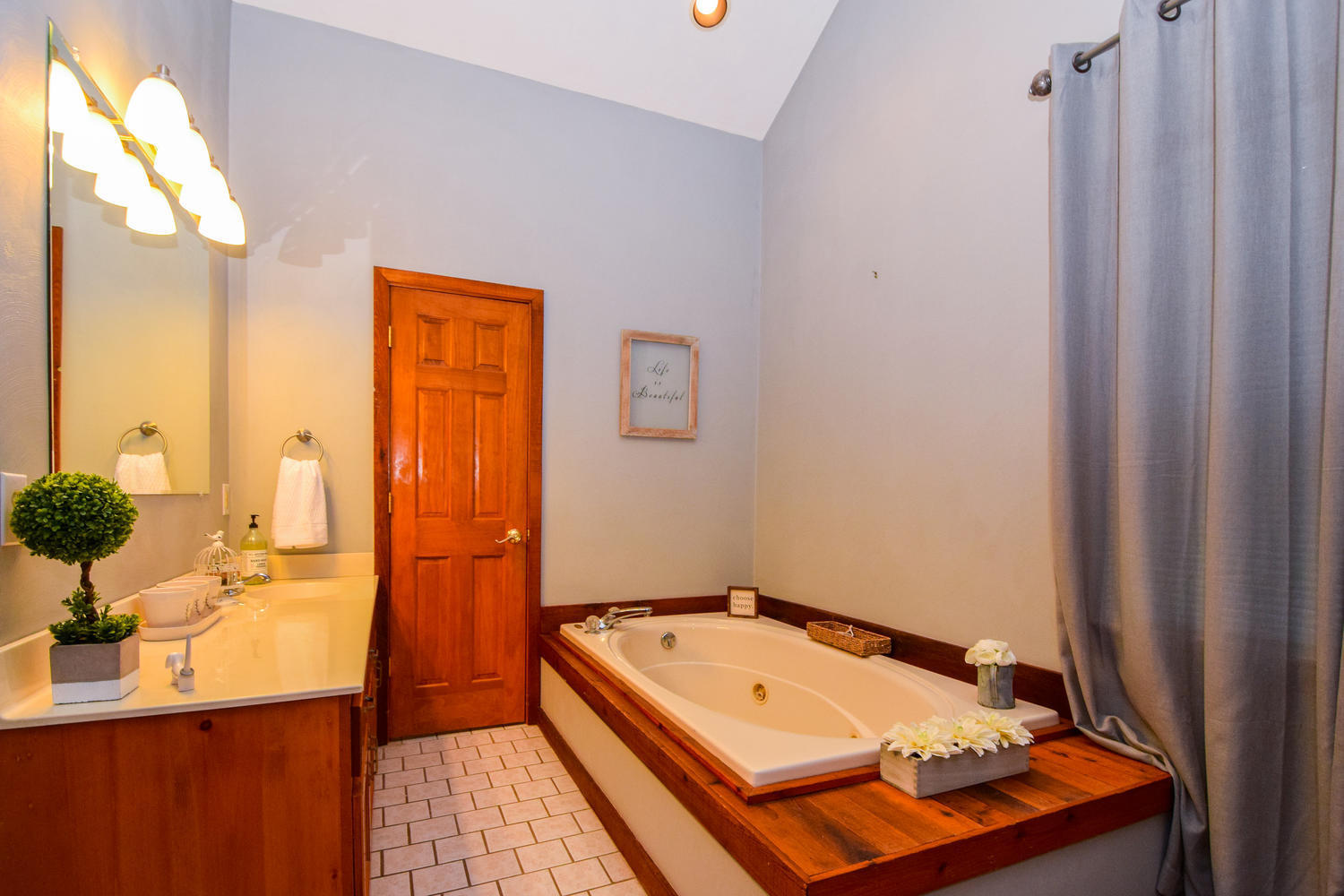 256 Deep Woods Road Hardy, VA 24101 - Photo 12 of 42 a bathroom with a tub sink and mirror