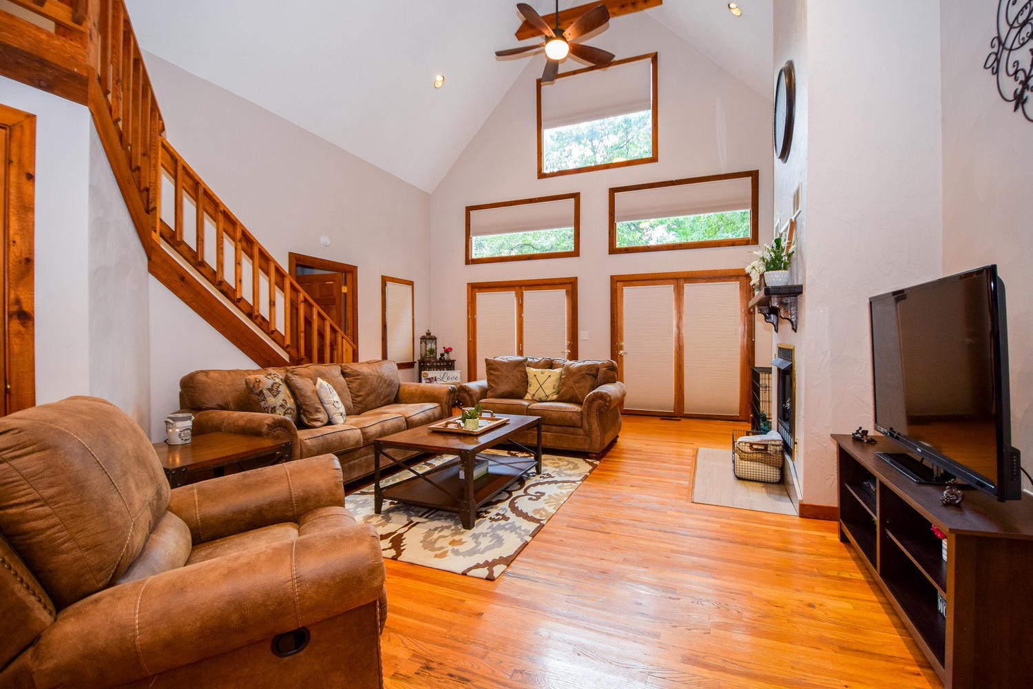256 Deep Woods Road Hardy, VA 24101 - Photo 3 of 42 a living room with furniture a flat screen tv and a floor to ceiling window