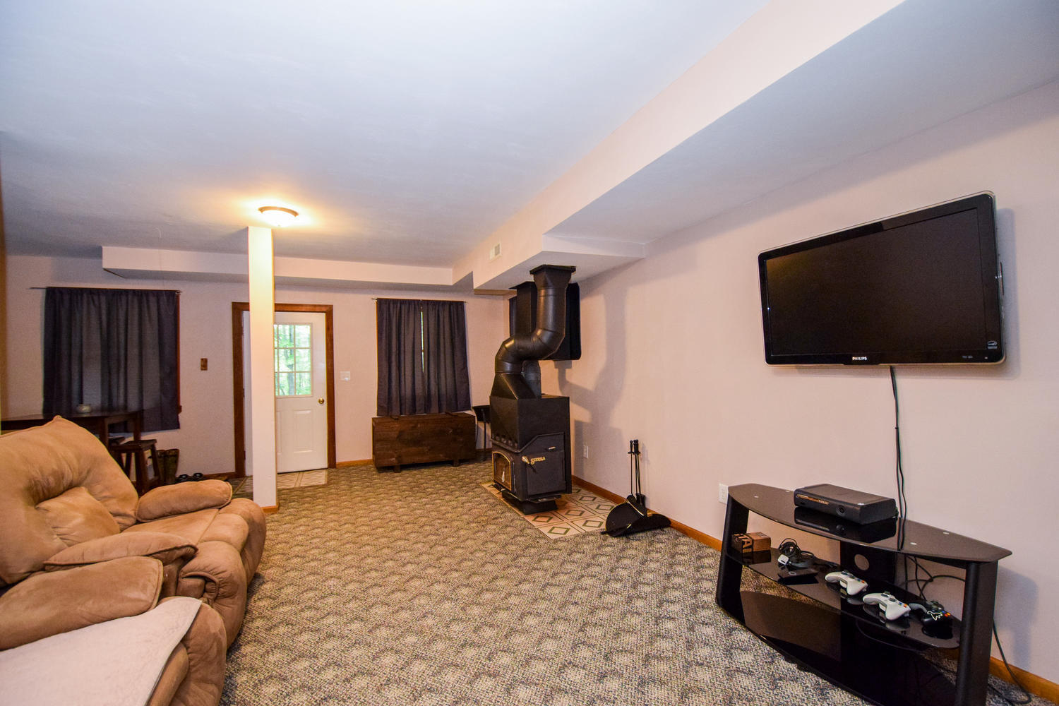 256 Deep Woods Road Hardy, VA 24101 - Photo 21 of 42 a living room with furniture and a flat screen tv