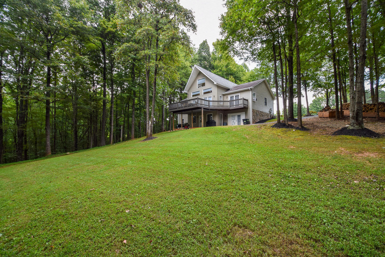 256 Deep Woods Road Hardy, VA 24101 - Photo 33 of 42 a house with a tree in front of it