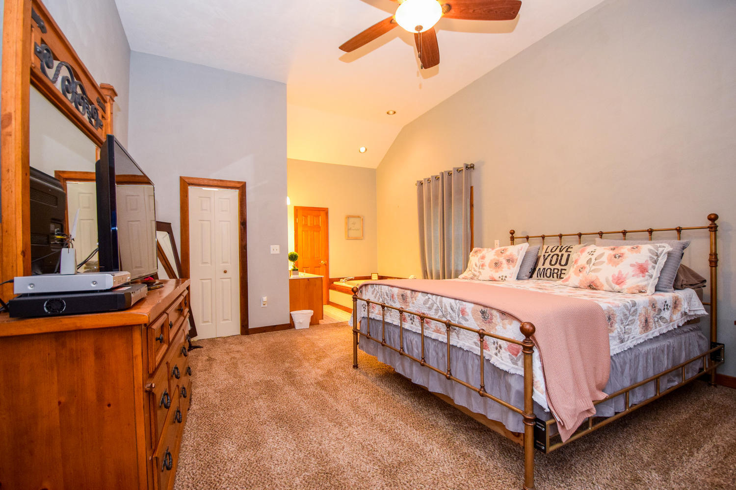 256 Deep Woods Road Hardy, VA 24101 - Photo 10 of 42 a bed room with a bed and a chandelier
