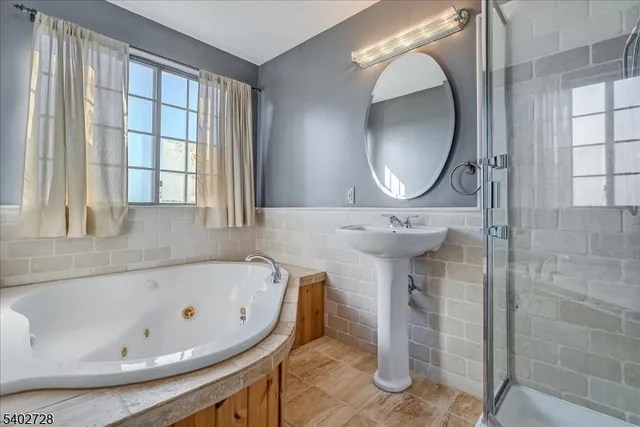 a bathroom with a bathtub and a sink