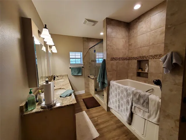 a bed room with a bed and a mirror