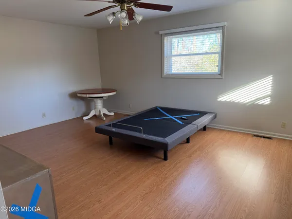 a bench sitting in a room next to a window