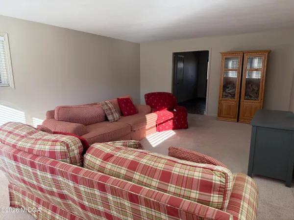 a bedroom with a bed and closet