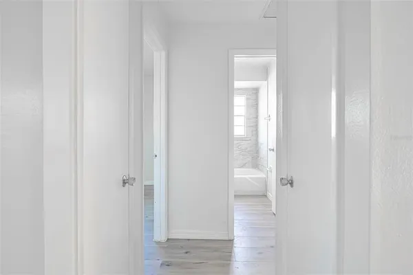 a view of a bathroom from a hallway