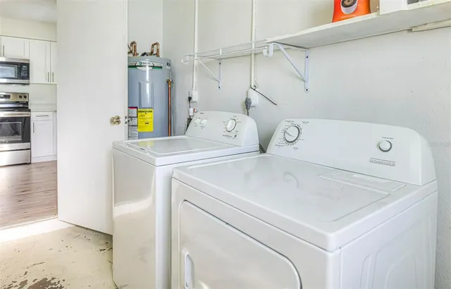 a utility room with dryer and washer