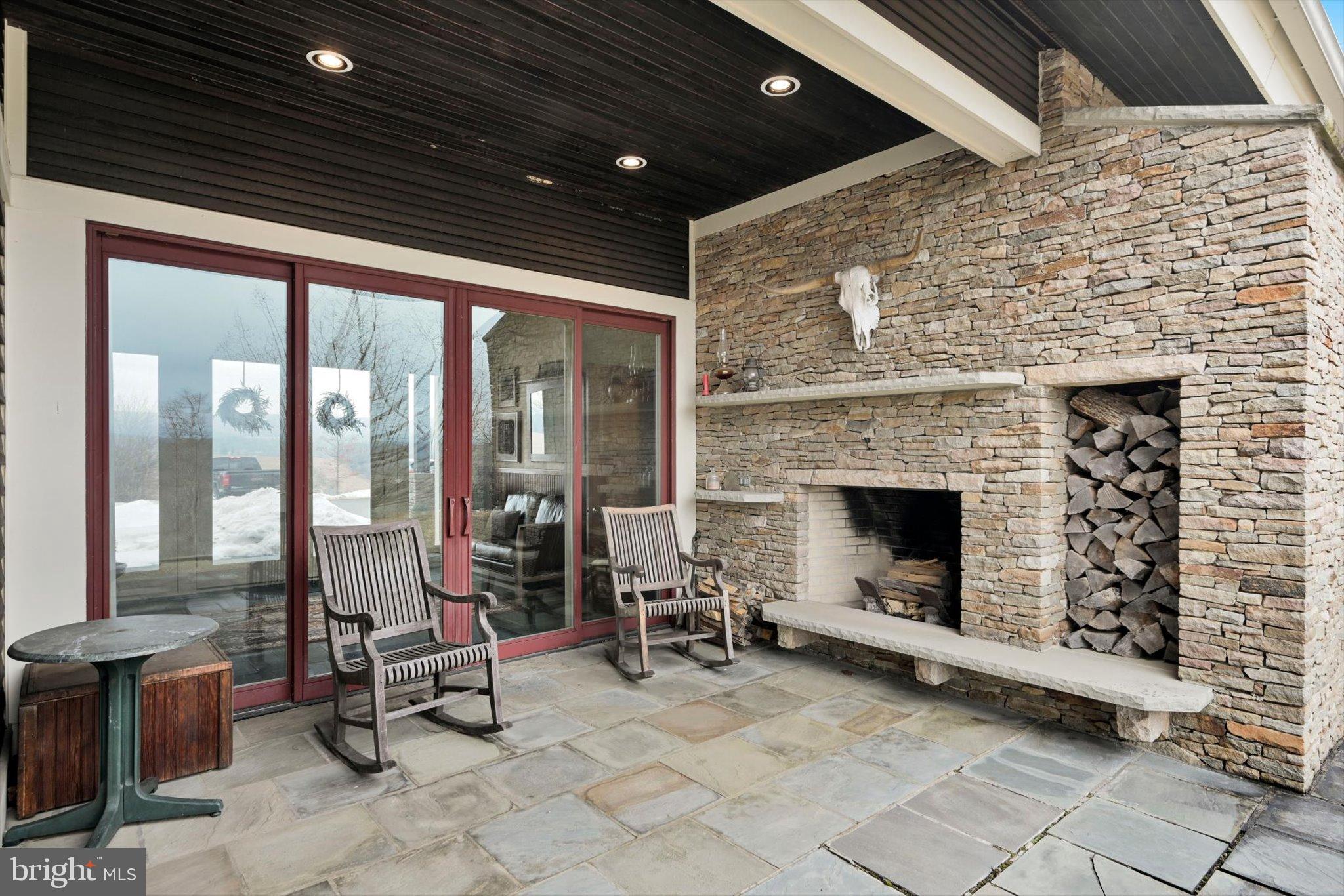 76 Zehner Road Landingville, PA 17972 - Photo 19 of 28 a living room with patio furniture and a fireplace