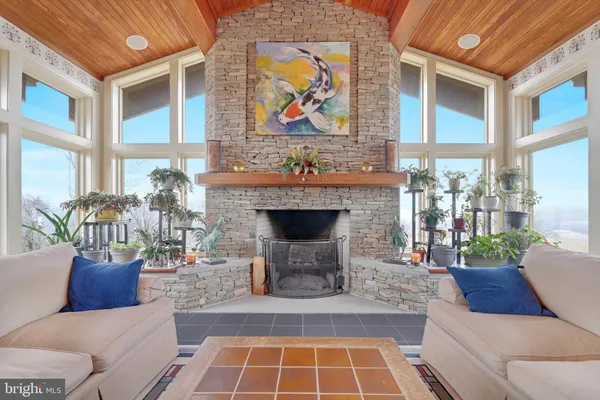 a view of a livingroom with furniture and a fireplace