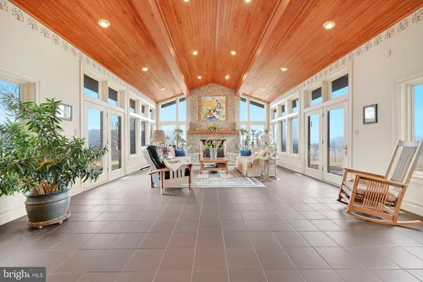a lobby with furniture and potted plants