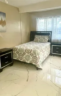 a bedroom with a bed and a cabinets