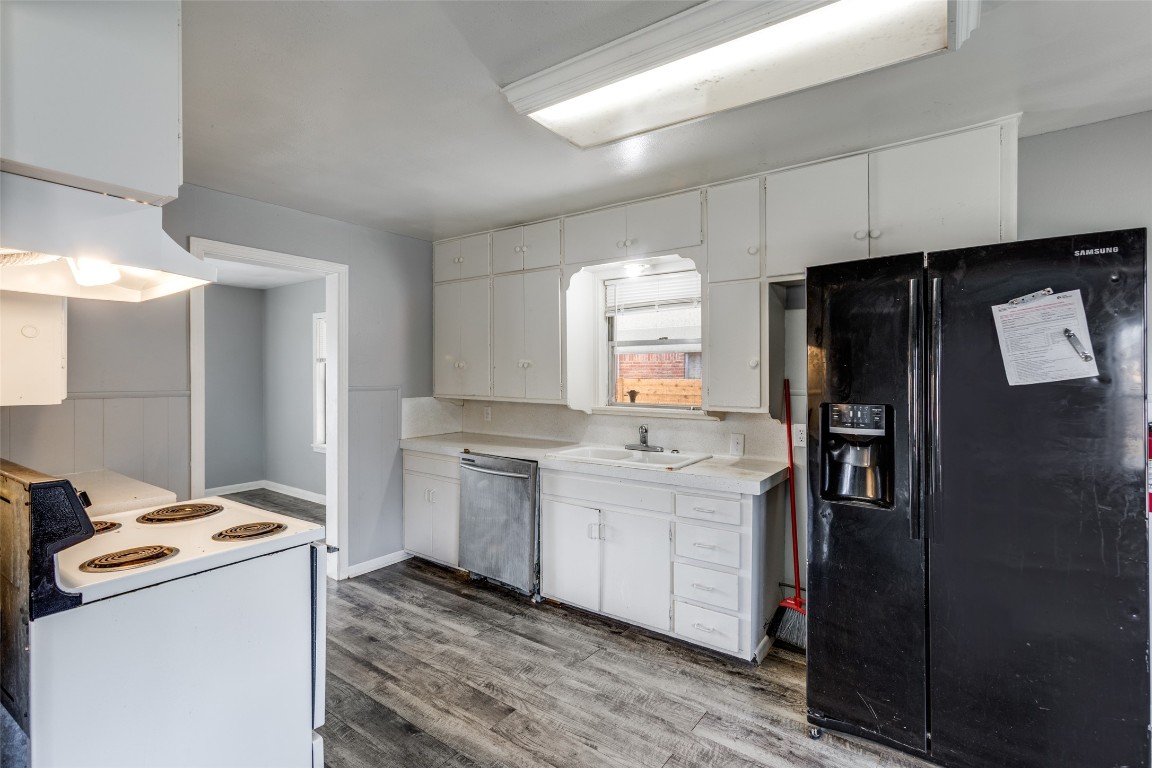 705 Campbell Street Lockhart, TX 78644 - Photo 13 of 30 a kitchen with a refrigerator sink and stove