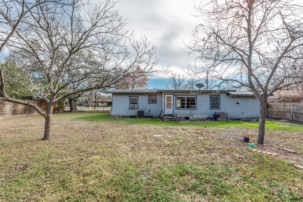 705 Campbell Street Lockhart, TX 78644 - Photo 23 of 30 a view of a house with a yard