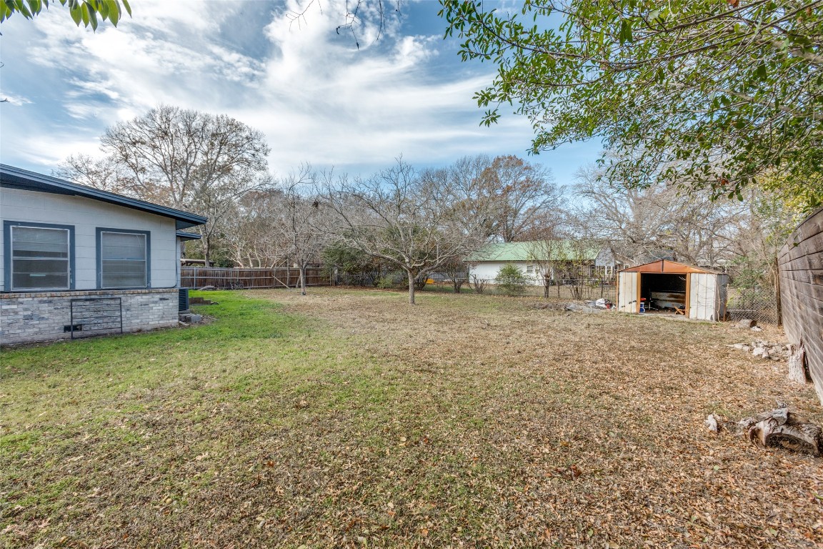 705 Campbell Street Lockhart, TX 78644 - Photo 25 of 30 a backyard of a house with lots of green space
