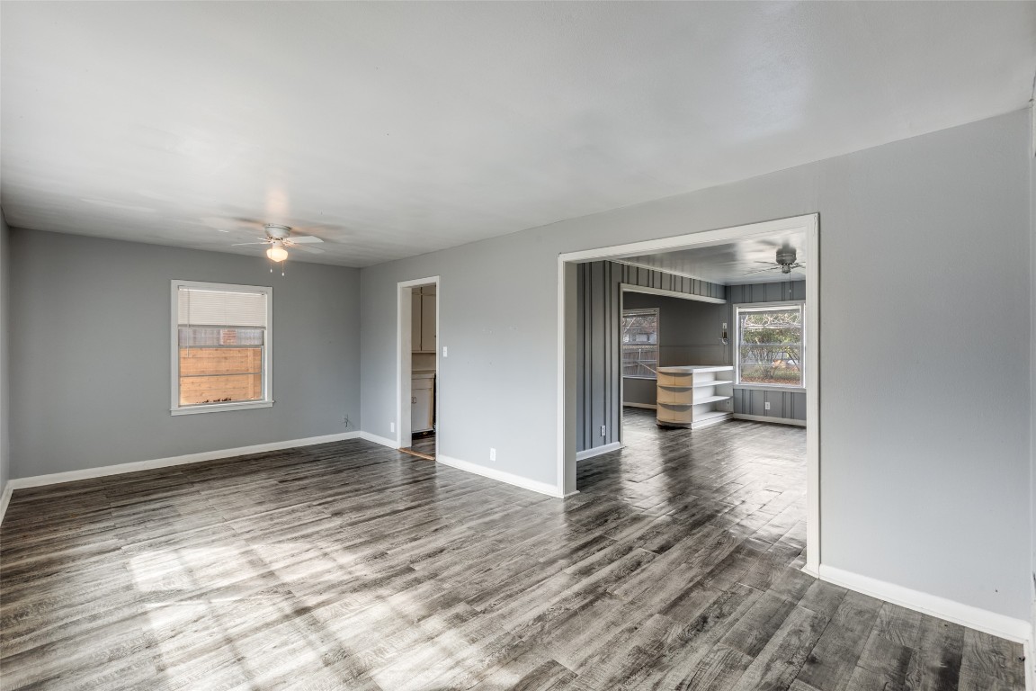705 Campbell Street Lockhart, TX 78644 - Photo 6 of 30 wooden floor in an empty room with a window