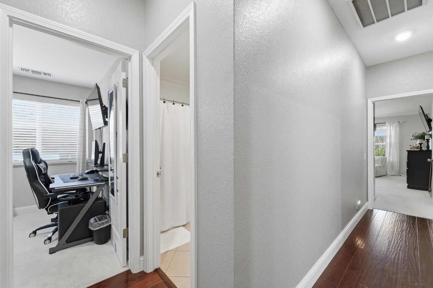 2220 Ellison Drive Modesto, CA 95355 - Photo 29 of 53 a view of a hallway with workspace and bathroom