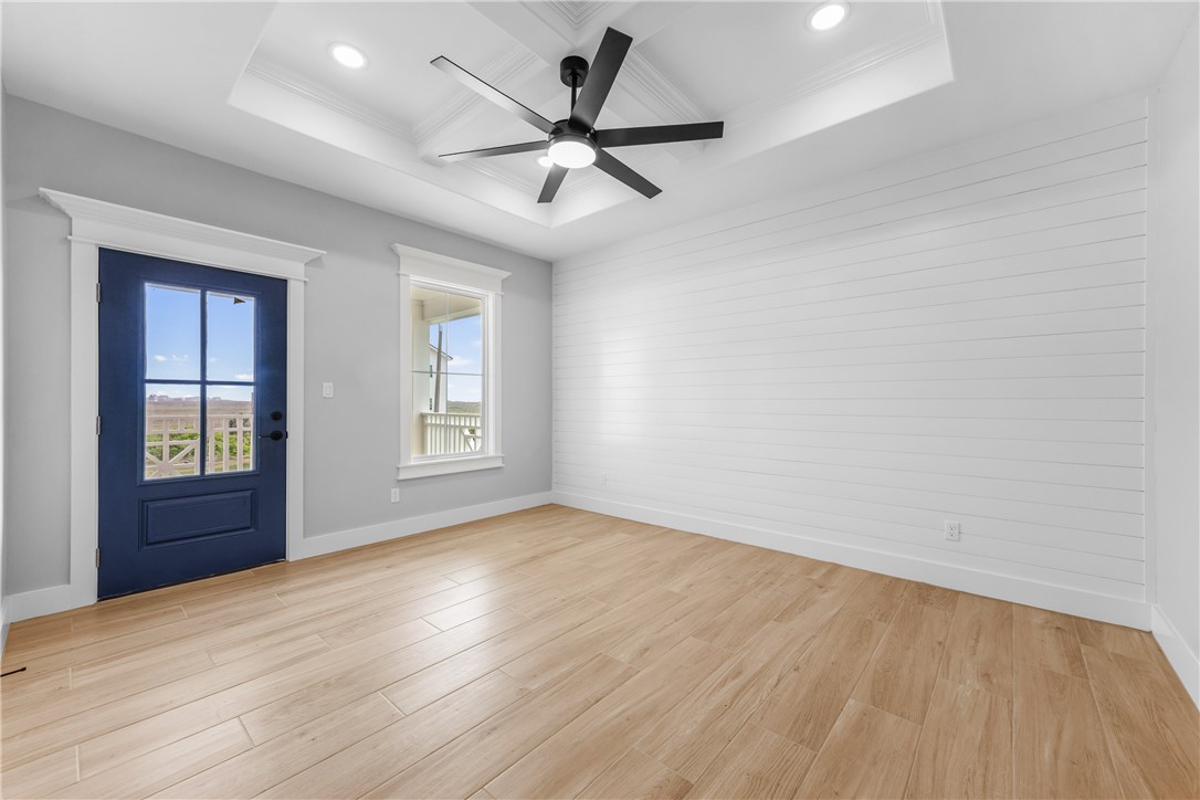 129 Frontside Drive Corpus Christi, TX 78373 - Photo 14 of 21 wooden floor in an empty room with a window