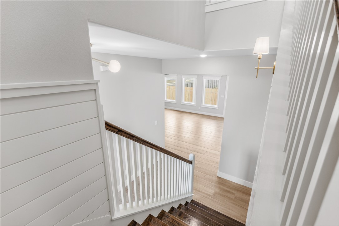 129 Frontside Drive Corpus Christi, TX 78373 - Photo 19 of 21 a view of a hallway with wooden floor and staircase