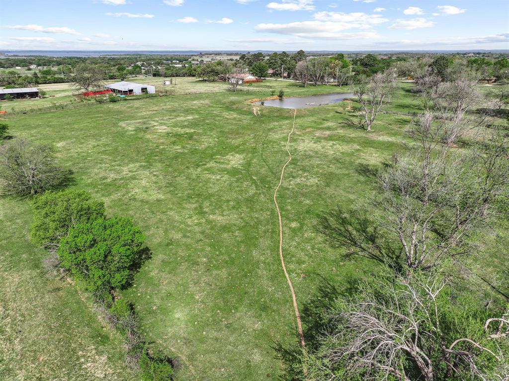 819 South Morrison Street Pilot Point, TX 76258 - Photo 11 of 12 a view of an outdoor space and a yard