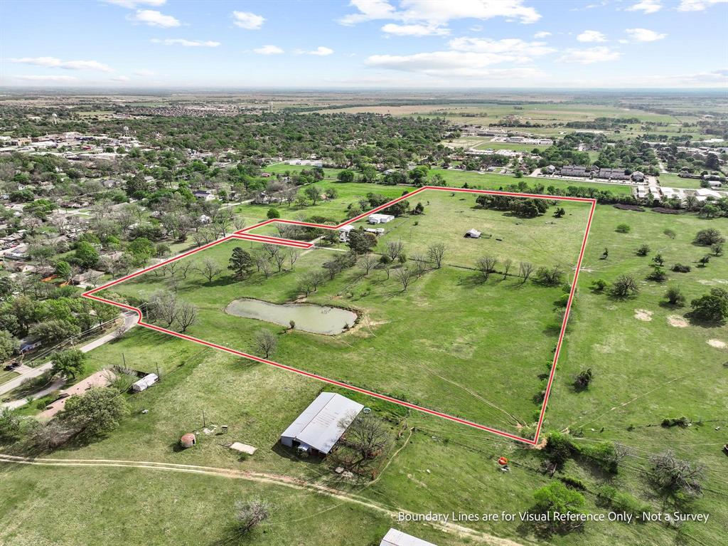 819 South Morrison Street Pilot Point, TX 76258 - Photo 8 of 12 an aerial view of residential houses with outdoor space