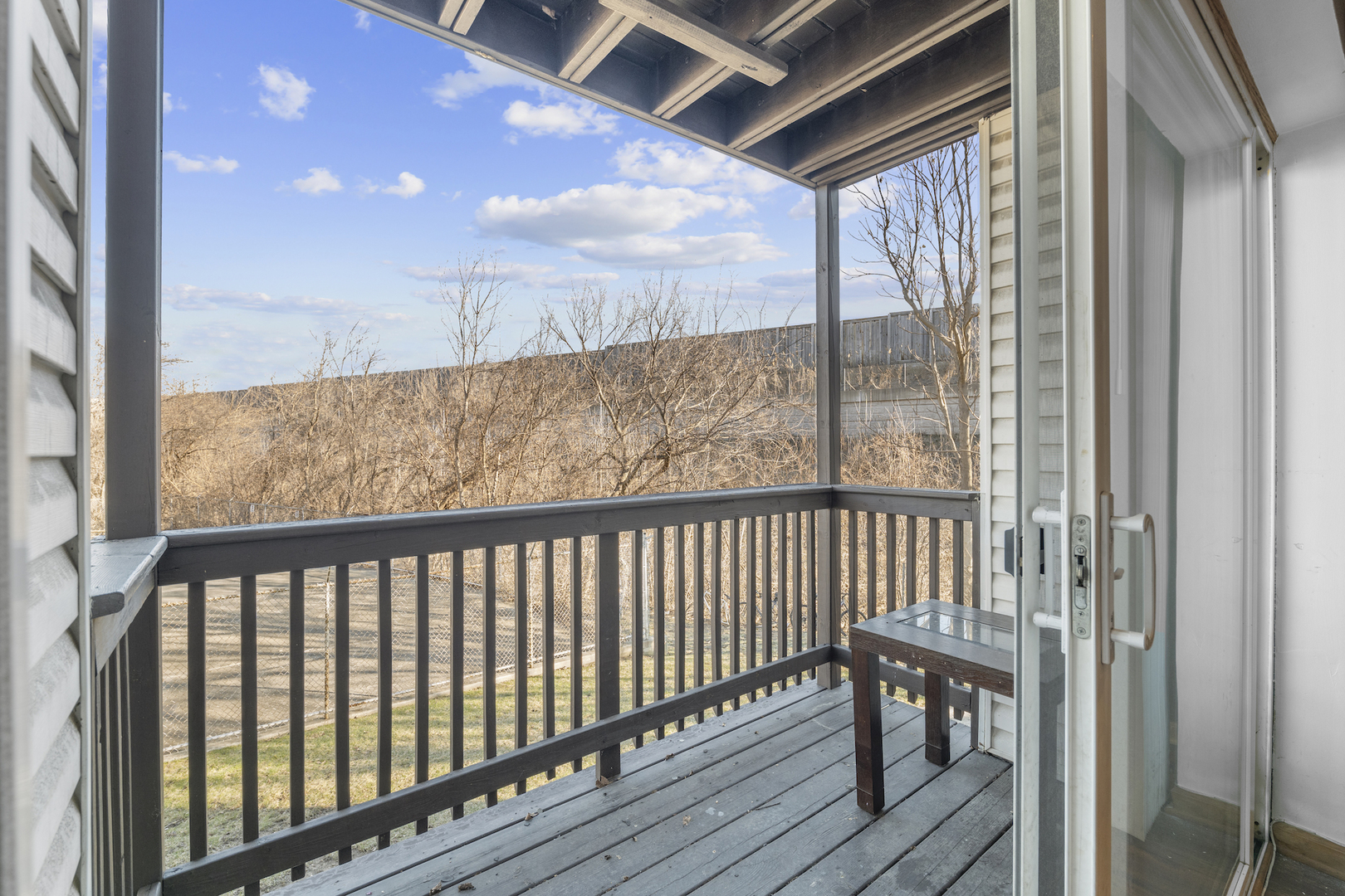 10440 Brooks Lane, Unit B4 Chicago Ridge, IL 60415 - Photo 4 of 14 a view of a balcony with wooden floor