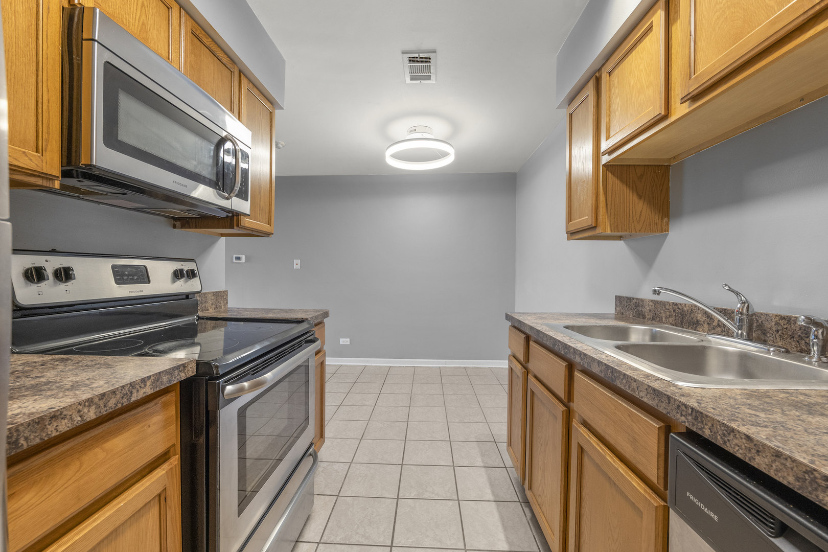 10440 Brooks Lane, Unit B4 Chicago Ridge, IL 60415 - Photo 7 of 14 a kitchen with granite countertop a sink and a stove