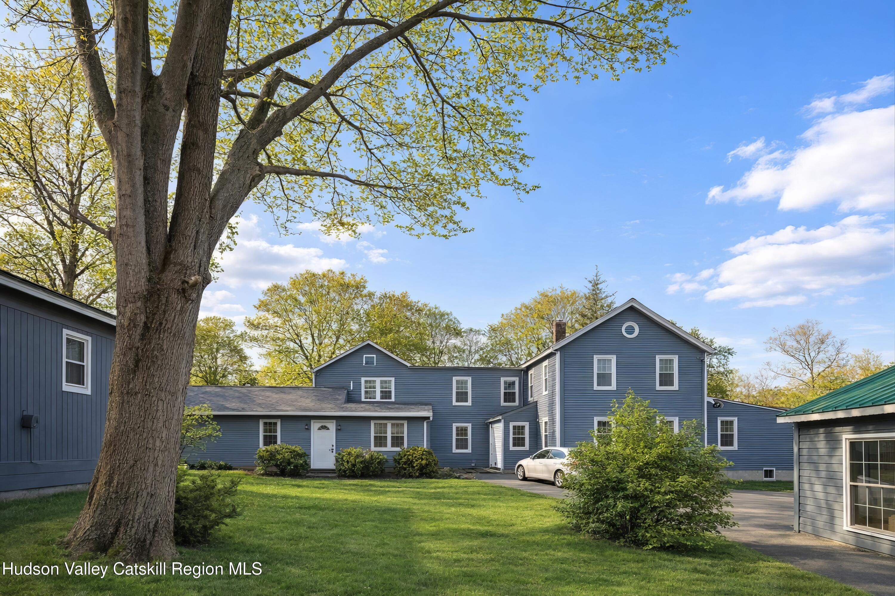 586 Old Rte 23 Cairo, NY 12405 - Photo 1 of 16 a front view of a house with a yard