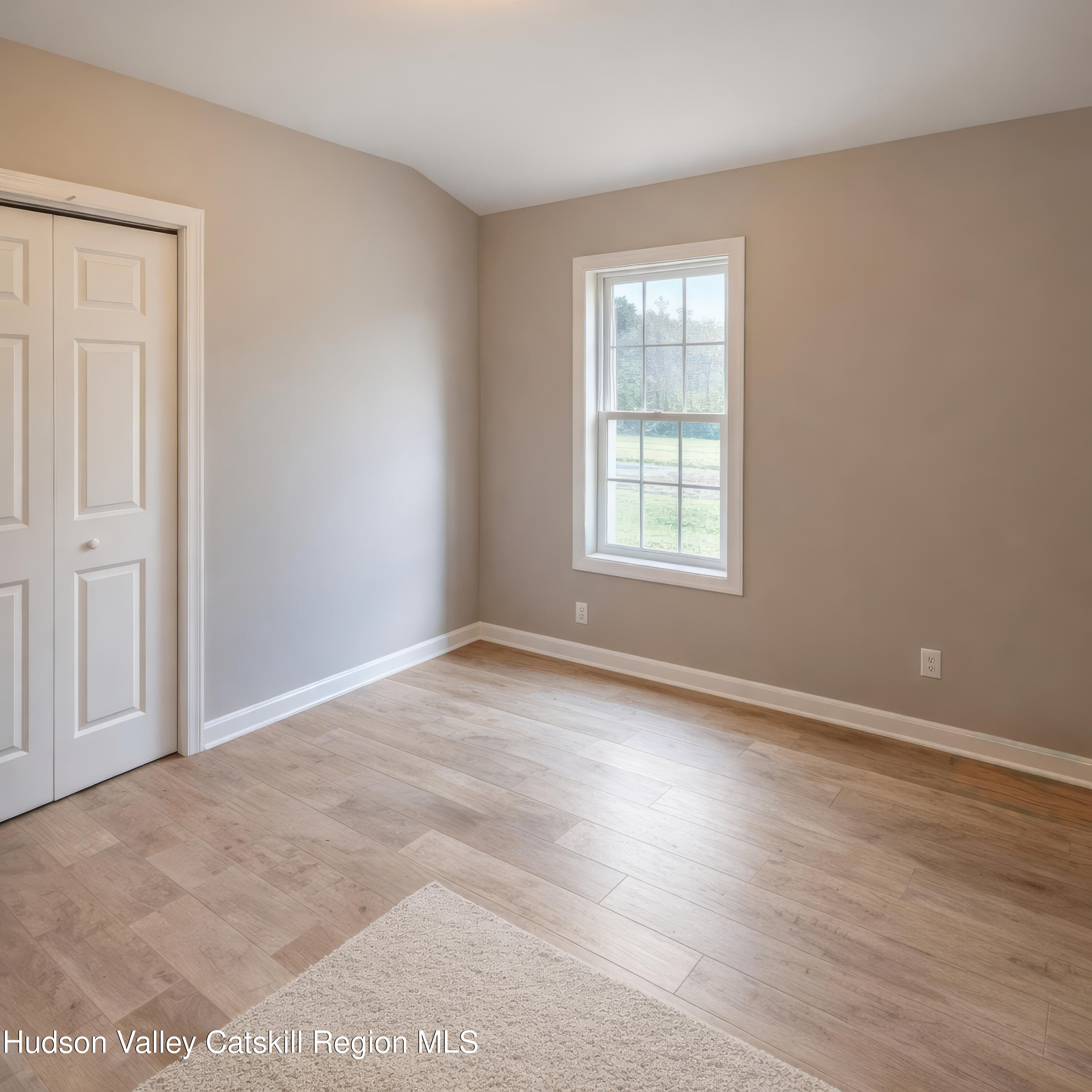 586 Old Rte 23 Cairo, NY 12405 - Photo 11 of 16 an empty room with wooden floor and windows