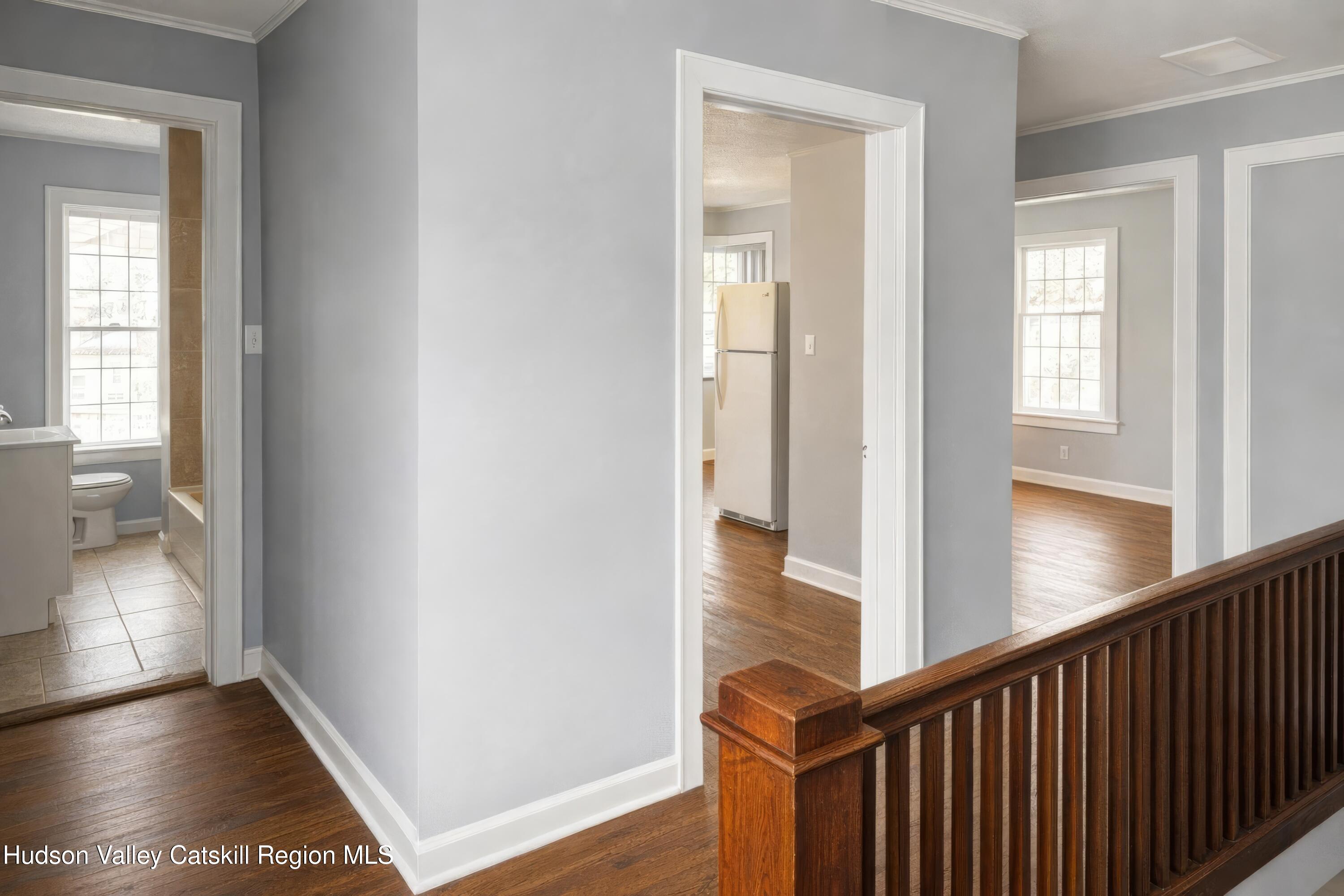 586 Old Rte 23 Cairo, NY 12405 - Photo 14 of 16 a view of a hallway with wooden floor and a living room