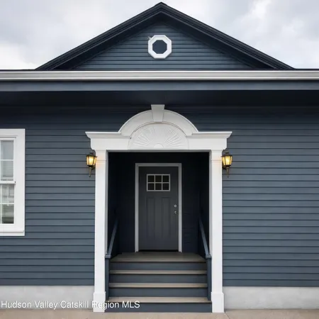 a front view of a house with garage