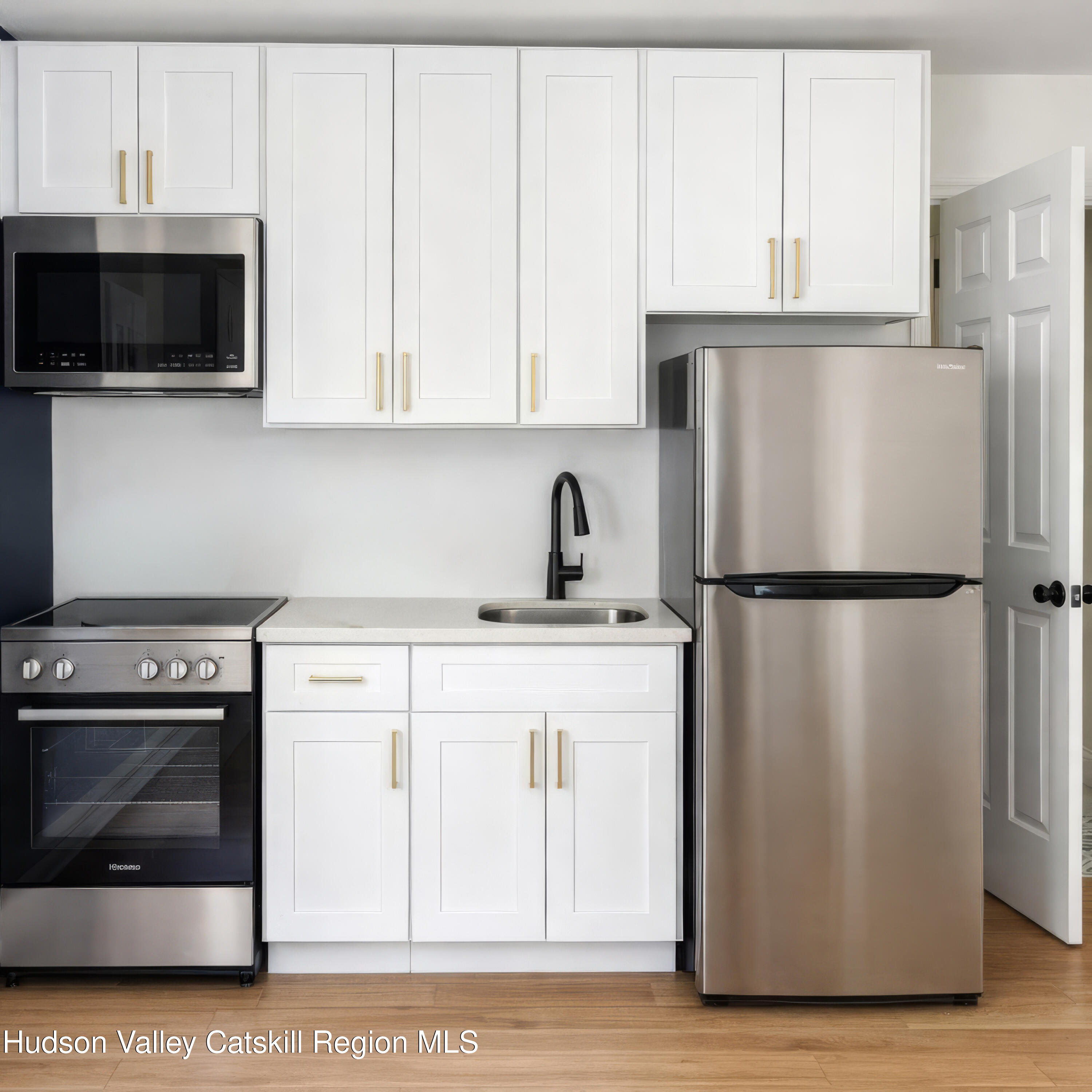 586 Old Rte 23 Cairo, NY 12405 - Photo 7 of 16 a kitchen with stainless steel appliances a refrigerator stove and microwave
