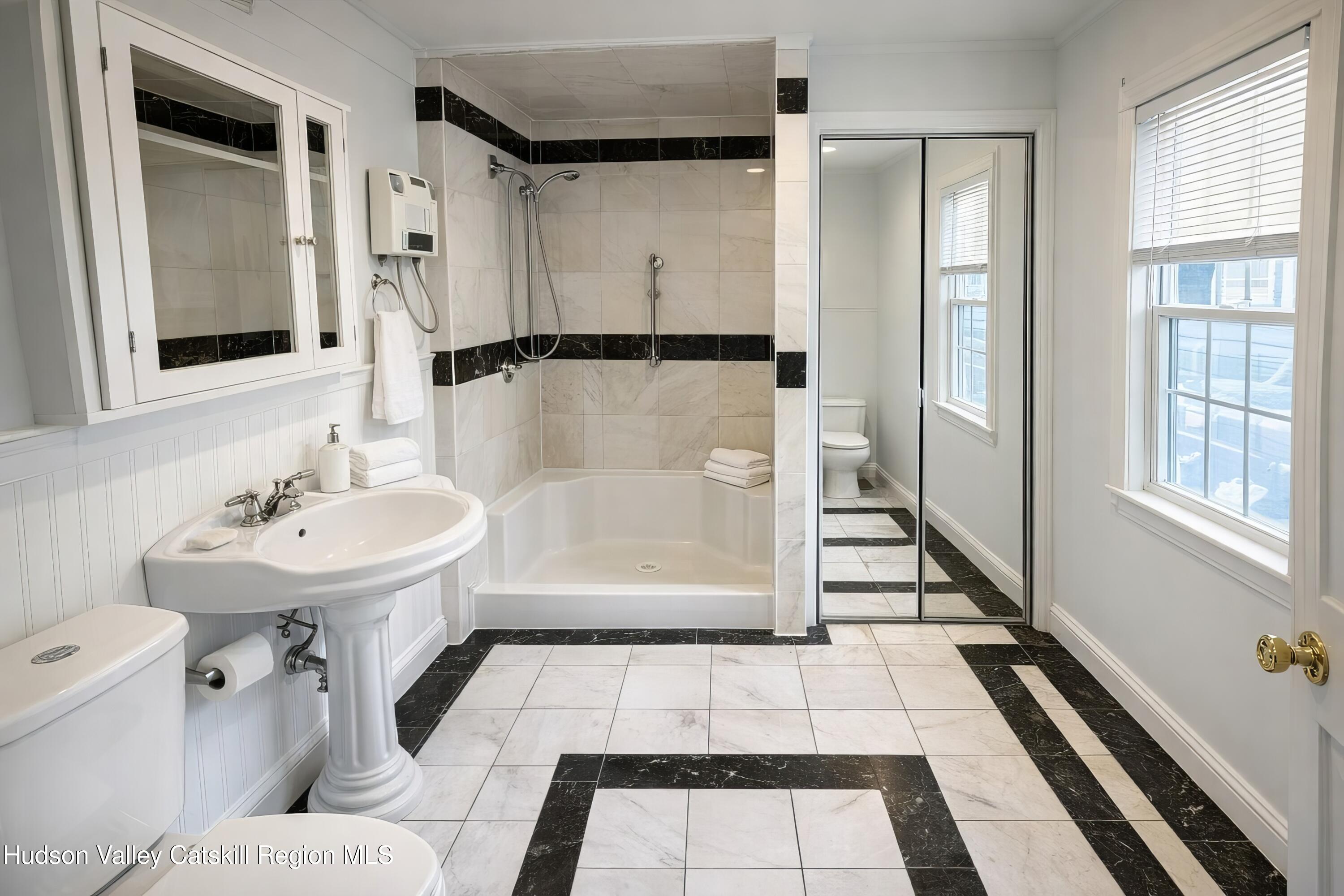 586 Old Rte 23 Cairo, NY 12405 - Photo 10 of 16 a bathroom with a sink toilet and shower