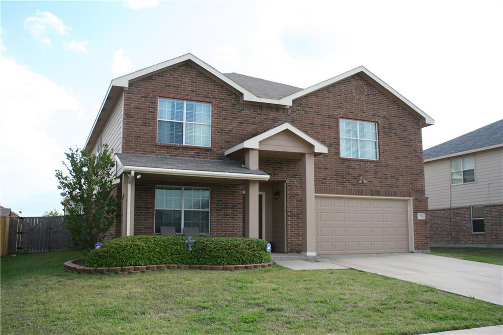 1710 Santa Fe Trail Krum, TX 76249 - Photo 1 of 1 a front view of a house with a garden and plants