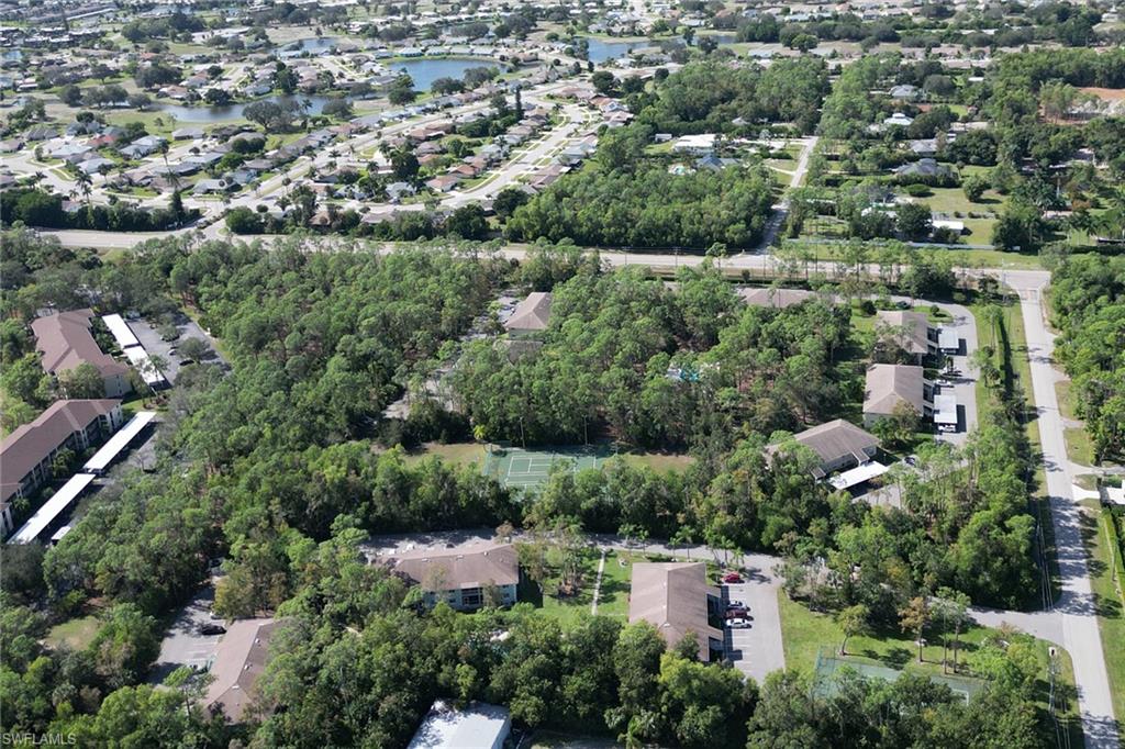 5675 Whitaker Road, Unit B101 Naples, FL 34112 - Photo 31 of 45 an aerial view of a city with lots of residential buildings