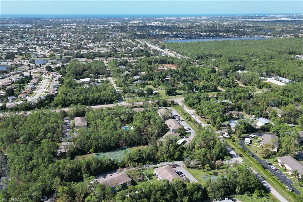 5675 Whitaker Road, Unit B101 Naples, FL 34112 - Photo 33 of 45 an aerial view of a city