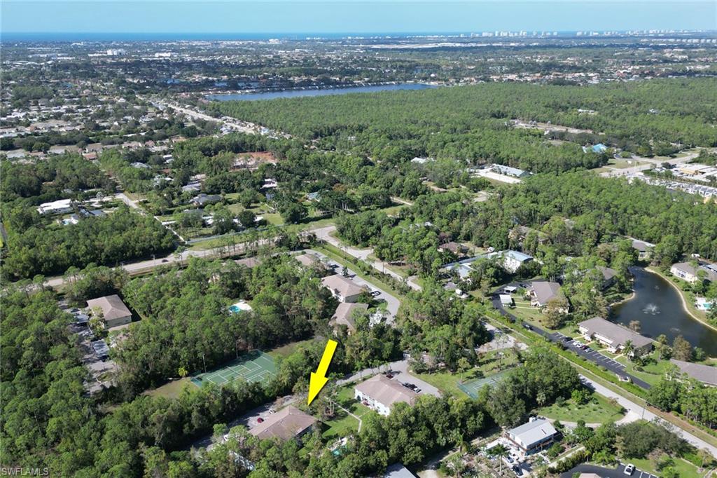 5675 Whitaker Road, Unit B101 Naples, FL 34112 - Photo 36 of 45 an aerial view of a city with lots of residential buildings