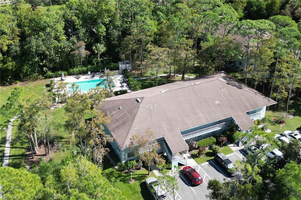 5675 Whitaker Road, Unit B101 Naples, FL 34112 - Photo 45 of 45 a aerial view of a house with a yard and potted plants