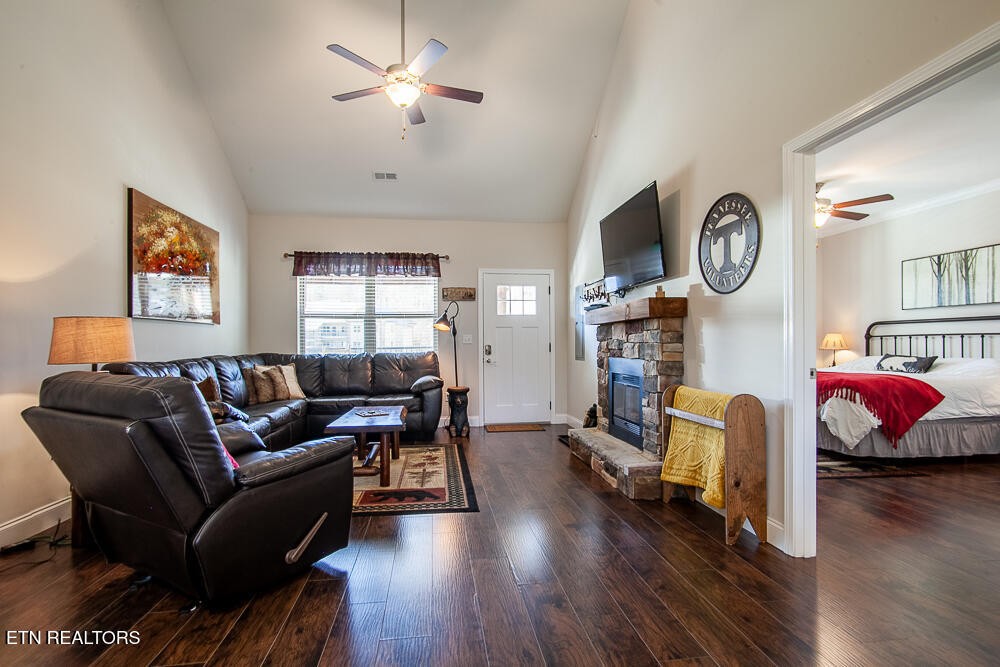 338 Shooting Star Loop, Unit 203 Townsend, TN 37882 - Photo 8 of 30 a living room with furniture a fireplace and a window