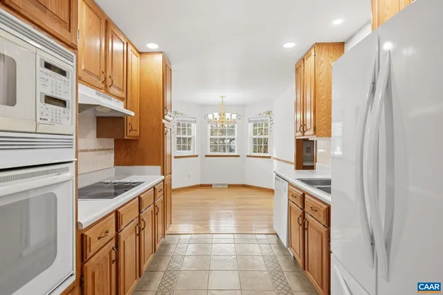 a view of a kitchen with a sink and cabinets
