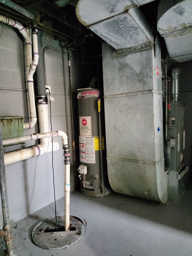 7910 South Muskegon Avenue, Unit 3 Chicago, IL 60617 - Photo 17 of 17 a view of water heater room
