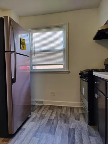 a room with wooden floor and window