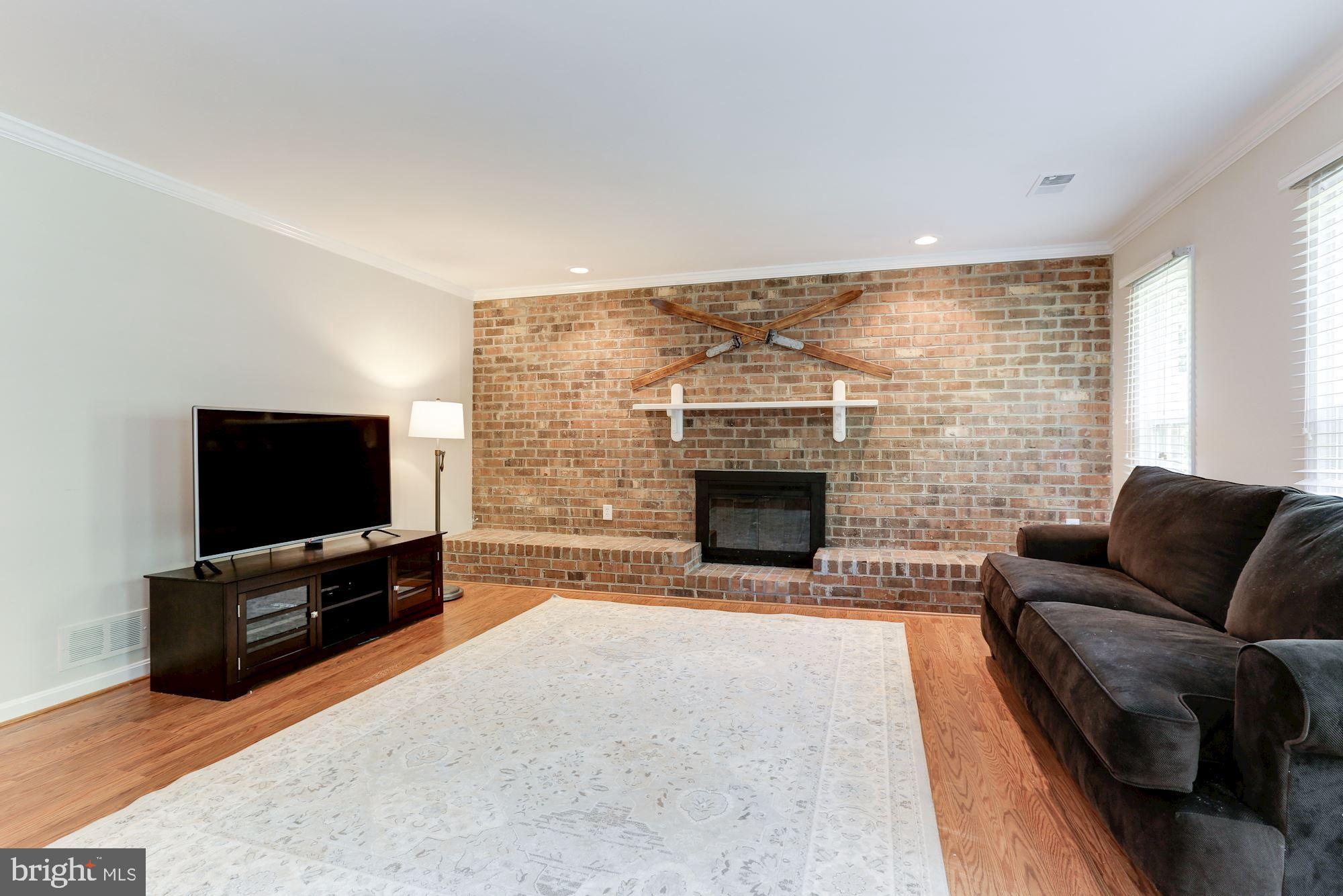 12335 Coleraine Court Reston, VA 20191 - Photo 43 of 84 Family Room / Rec Room with Lovely Brick Wall
