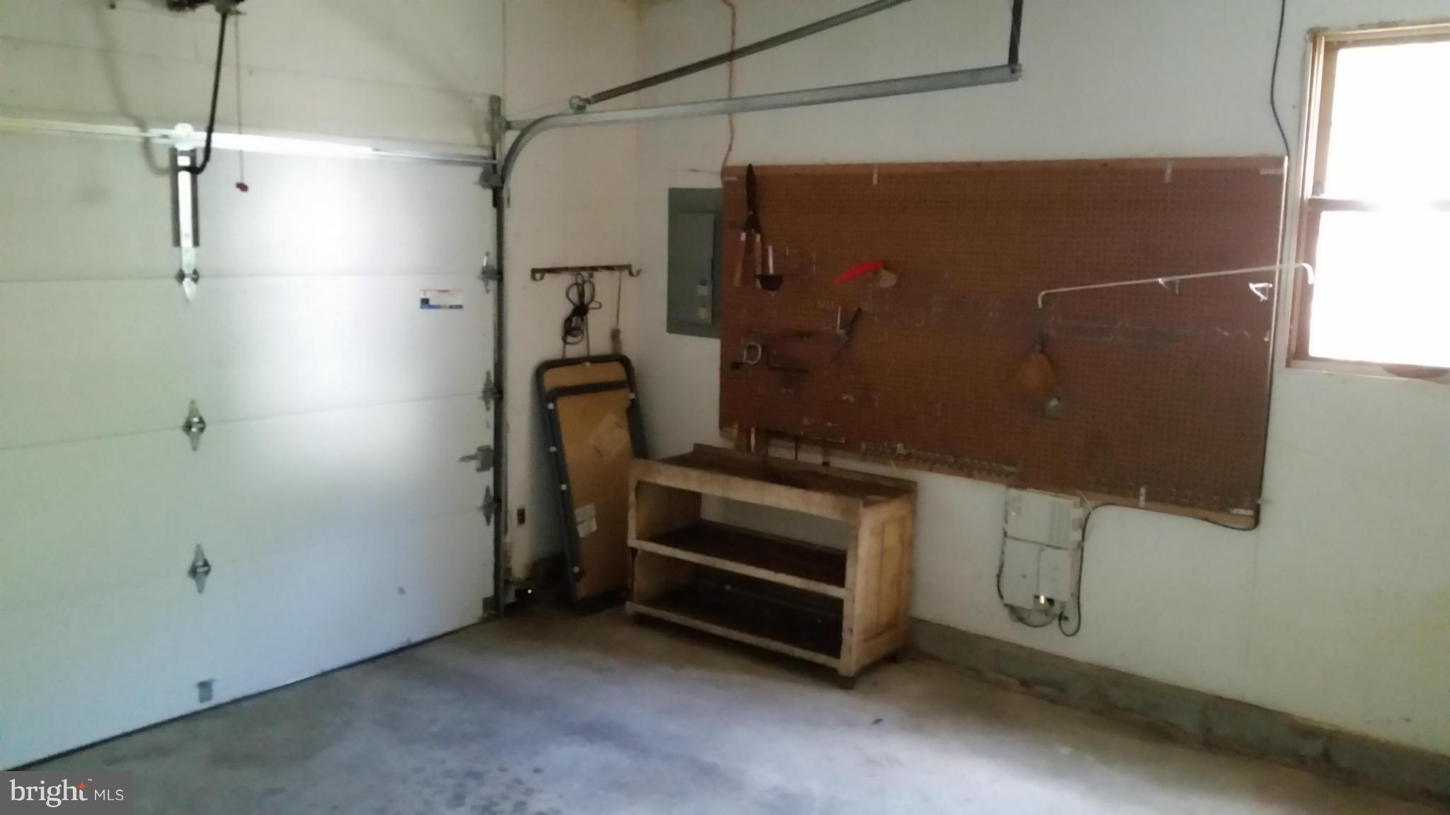 8705 Crest Road Severn, MD 21144 - Photo 10 of 13 Garage with tool storage
