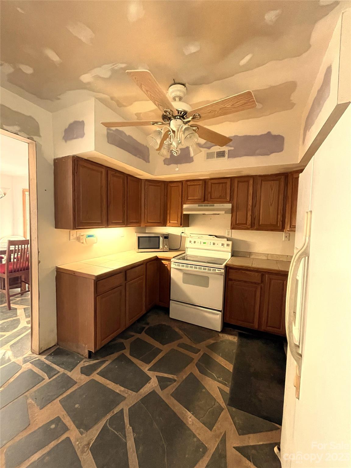 930 Old Pinckney Road York, SC 29745 - Photo 3 of 13 a kitchen with a stove a sink and a refrigerator