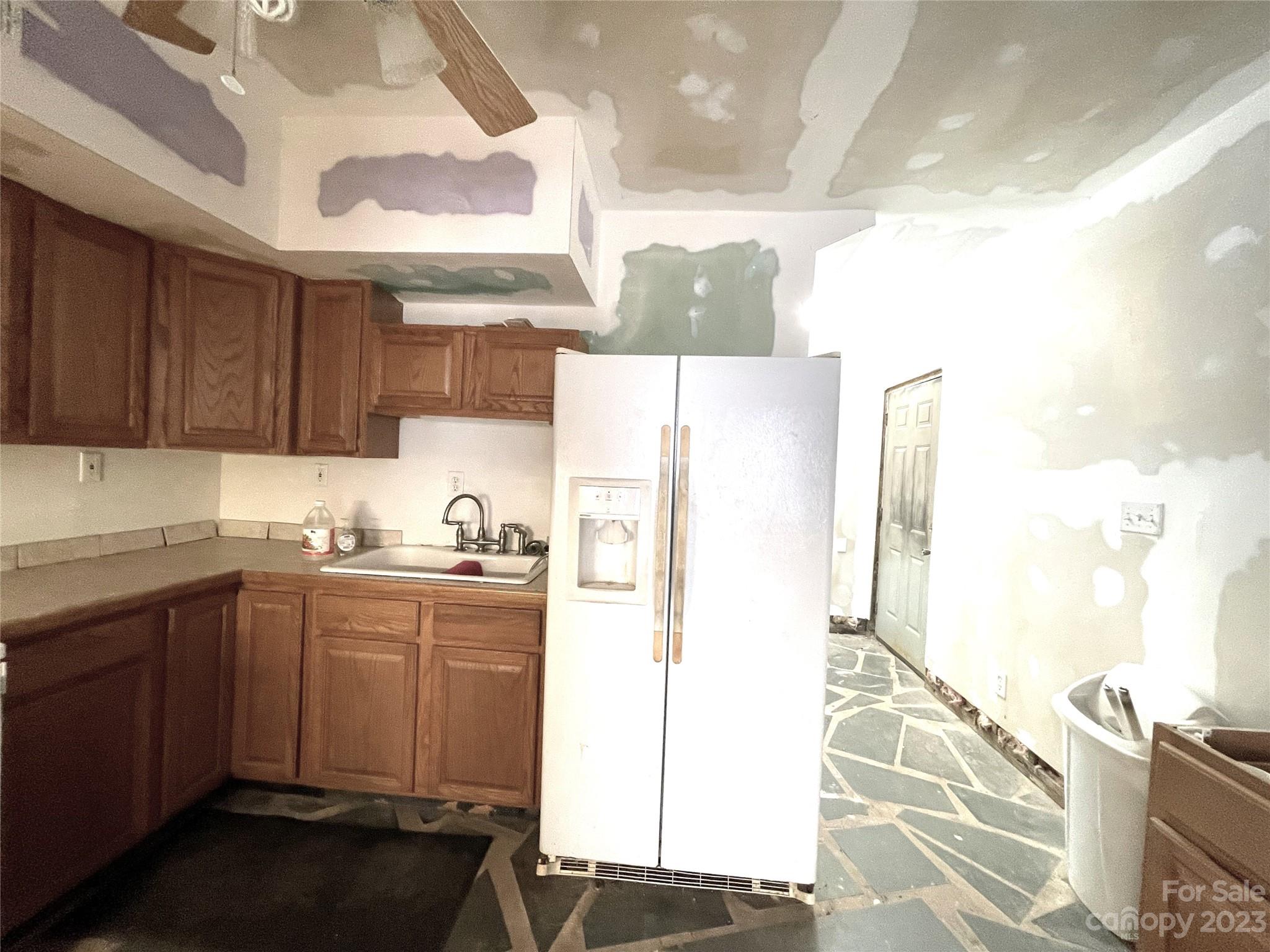 930 Old Pinckney Road York, SC 29745 - Photo 4 of 13 a kitchen with a sink a refrigerator and wooden floor
