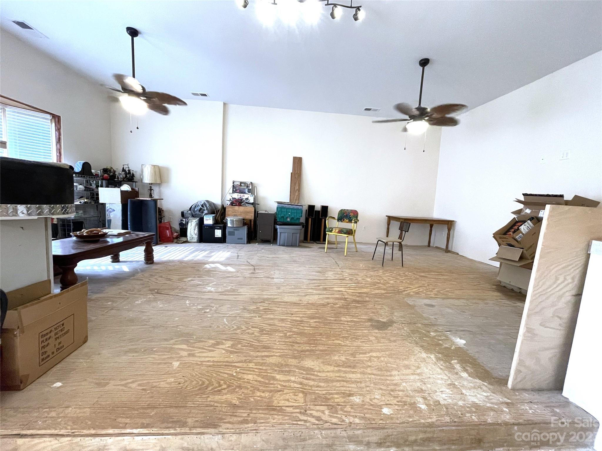 930 Old Pinckney Road York, SC 29745 - Photo 7 of 13 a living room with furniture a chandelier and a flat screen tv