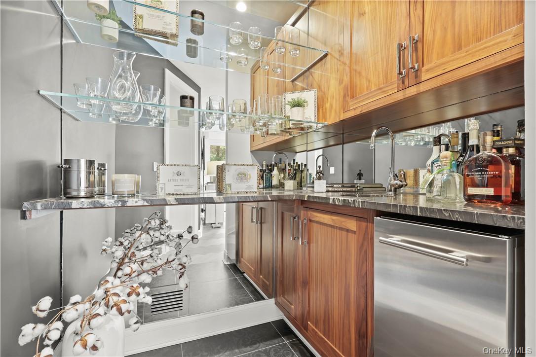 343 Purchase Street Rye, NY 10580 - Photo 20 of 36 a kitchen with stainless steel appliances granite countertop a sink and cabinets